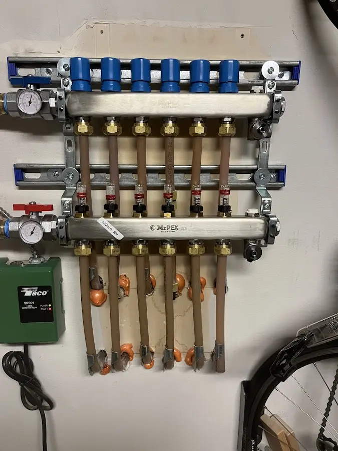 Plumber performing Water Heater Repair at a residential property in Johnson City